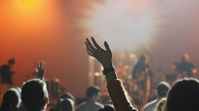 shallow focus photography of hand and people