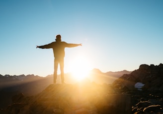 person standing on hill